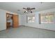 Bright bedroom features tile floors, ceiling fan, and backyard access at 829 E Echo Ln, Phoenix, AZ 85020