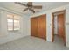 Bedroom with a window and closet, offering a bright and functional living space at 829 E Echo Ln, Phoenix, AZ 85020