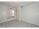 Cozy bedroom featuring a window and a closet for convenient storage at 829 E Echo Ln, Phoenix, AZ 85020