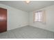 Bedroom with tiled floor and window that brings in a comfortable amount of light at 829 E Echo Ln, Phoenix, AZ 85020