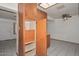 Spacious kitchen featuring wood cabinets, open shelving, and lots of storage at 829 E Echo Ln, Phoenix, AZ 85020