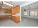 Open kitchen layout with wooden cabinets and light countertops for easy meal preparation at 829 E Echo Ln, Phoenix, AZ 85020