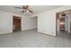 Spacious living area with tiled flooring, ceiling fan, and easy access to other rooms at 829 E Echo Ln, Phoenix, AZ 85020