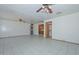 Spacious living room featuring tile floors and ceiling fans for added comfort at 829 E Echo Ln, Phoenix, AZ 85020