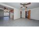 Open living space featuring tile flooring, ceiling fans, and an open kitchen layout at 829 E Echo Ln, Phoenix, AZ 85020