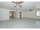 Spacious living room featuring tile floors and ceiling fans for added comfort at 829 E Echo Ln, Phoenix, AZ 85020