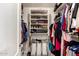 Walk-in closet with extensive shelving and hanging storage for optimal organization at 8319 E Portobello Ave, Mesa, AZ 85212
