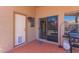 Cozy outdoor patio area with sliding glass door and space for a grill at 8319 E Portobello Ave, Mesa, AZ 85212