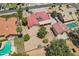 Aerial view of home with red tile roof, desert landscaping, and separate garage at 8511 W Via Montoya Dr, Peoria, AZ 85383