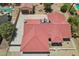 Aerial view of a home with a red tile roof, spacious driveway, and detached garage at 8511 W Via Montoya Dr, Peoria, AZ 85383