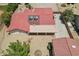 Aerial view of home with red tile roof, covered patio and desert landscaping at 8511 W Via Montoya Dr, Peoria, AZ 85383