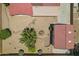Overhead view of a home with a red roof, separate garage and desert landscaping with trees and rock accents at 8511 W Via Montoya Dr, Peoria, AZ 85383
