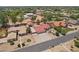 Aerial view of the property including the main house, detached garage, desert landscaping, mature trees and a pool nearby at 8511 W Via Montoya Dr, Peoria, AZ 85383