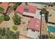 Aerial view of home with red tile roof, long driveway, and separate garage at 8511 W Via Montoya Dr, Peoria, AZ 85383
