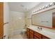 Bathroom featuring a bathtub, shower, vanity, and a large mirror at 8511 W Via Montoya Dr, Peoria, AZ 85383