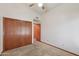 Bedroom featuring a closet and neutral-colored carpet at 8511 W Via Montoya Dr, Peoria, AZ 85383