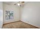 Bedroom with neutral colored walls, carpet, and a ceiling fan at 8511 W Via Montoya Dr, Peoria, AZ 85383