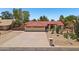 Desert landscaped home with a 3-car garage and circular driveway at 8511 W Via Montoya Dr, Peoria, AZ 85383