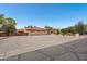 Property with a three-car garage, red tile roof, and xeriscaped front yard with desert vegetation at 8511 W Via Montoya Dr, Peoria, AZ 85383