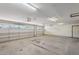 This large garage features three bays with openers and ample space for parking and storage at 8511 W Via Montoya Dr, Peoria, AZ 85383