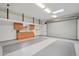 Spacious garage features a work area with storage cabinets and epoxy flooring at 8511 W Via Montoya Dr, Peoria, AZ 85383