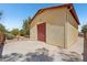 Detached garage with red door and ample parking, with desert landscaping at 8511 W Via Montoya Dr, Peoria, AZ 85383