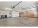 A spacious garage offers plenty of storage space with built-in cabinets and a utility sink at 8511 W Via Montoya Dr, Peoria, AZ 85383
