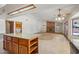 Spacious, airy room featuring skylights, a granite island and a cozy fireplace at 8511 W Via Montoya Dr, Peoria, AZ 85383