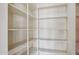 A spacious, walk-in pantry is equipped with numerous shelves for optimal storage at 8511 W Via Montoya Dr, Peoria, AZ 85383