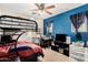 Bedroom features a bunk bed and a blue accent wall with desk at 942 S Deerfield Ln, Gilbert, AZ 85296