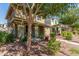 Inviting home exterior with desert landscaping, a charming porch swing, and a pathway at 942 S Deerfield Ln, Gilbert, AZ 85296