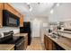 Efficient kitchen with stainless steel appliances, laminate countertops, and tile flooring at 942 S Deerfield Ln, Gilbert, AZ 85296