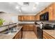 Well-maintained kitchen with plenty of cabinet space, laminate countertops, and recessed lighting at 942 S Deerfield Ln, Gilbert, AZ 85296
