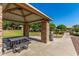 Community picnic area offering stone columns, picnic tables, and barbeque grills, with green landscaping at 942 S Deerfield Ln, Gilbert, AZ 85296