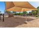 Community playground with climbing structures, rope nets, and a sun shade canopy for outdoor fun at 942 S Deerfield Ln, Gilbert, AZ 85296
