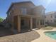 Backyard view featuring a covered patio and access to the pool at 955 W Laurel Ave, Gilbert, AZ 85233