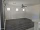 Bright living room featuring modern flooring and a ceiling fan at 955 W Laurel Ave, Gilbert, AZ 85233