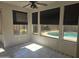 Bright sunroom with tile flooring, black window treatments, and view of the backyard pool at 955 W Laurel Ave, Gilbert, AZ 85233