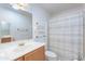 Bathroom featuring tile flooring, vanity, and tiled shower at 10513 W Roundelay Cir, Sun City, AZ 85351