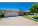 Charming single-story home with a well-manicured lawn and spacious driveway at 10513 W Roundelay Cir, Sun City, AZ 85351