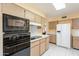 Bright kitchen with modern appliances and plentiful cabinet space at 10513 W Roundelay Cir, Sun City, AZ 85351