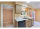 Kitchen featuring stainless steel sink, dishwasher, and plentiful storage space at 10513 W Roundelay Cir, Sun City, AZ 85351