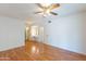 Spacious main bedroom featuring beautiful hardwood floors and dressing table at 10513 W Roundelay Cir, Sun City, AZ 85351