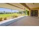 Spacious covered patio with views of well-maintained landscaping and lawns at 10513 W Roundelay Cir, Sun City, AZ 85351