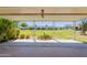 Covered patio with serene view of the lush green lawn and common area at 10513 W Roundelay Cir, Sun City, AZ 85351