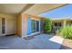 Covered patio featuring privacy wall and exterior access at 10513 W Roundelay Cir, Sun City, AZ 85351