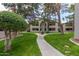 Condominium exterior featuring well maintained landscaping and walkways at 10610 S 48 St # 1068, Phoenix, AZ 85044