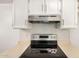Modern kitchen featuring an electric range and ample counter space at 10610 S 48 St # 1068, Phoenix, AZ 85044