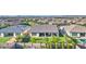 Aerial view of a well-maintained home with a lush backyard, landscaping, and community at 10643 E Tumbleweed Ave, Mesa, AZ 85212