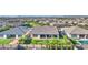 Aerial view of a well-maintained home with a lush backyard, landscaping, and community at 10643 E Tumbleweed Ave, Mesa, AZ 85212